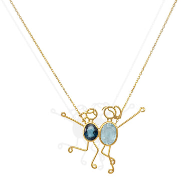 Handmade 18k gold necklace featuring blue topaz and spinel, symbolizing clarity and protection by DEMI & RUMER.