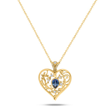 ELIXIR HEART pendant with blue sapphire and diamonds in heart-shaped gold design.