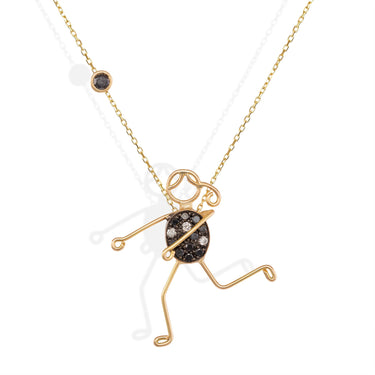 Handmade 18k gold character necklace with black and white diamond accents.