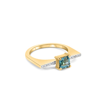18k gold GEOMUSE ring with princess cut blue topaz and diamonds.