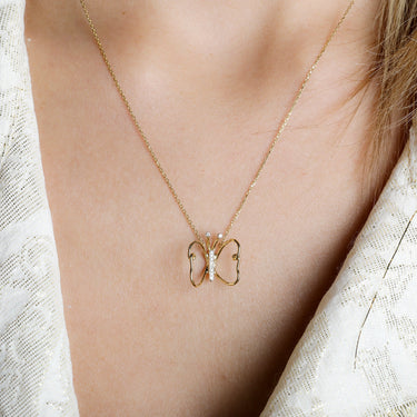 LUMINUS WINGS NECKLACE with butterfly design in 18k gold and 0.06ct white diamonds.
