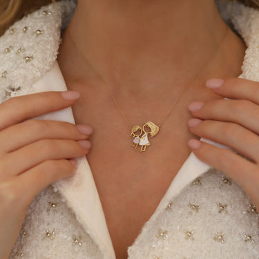 Gold charm necklace "PARIS & LISA" representing mother-daughter bond, 18k gold and enamel design.