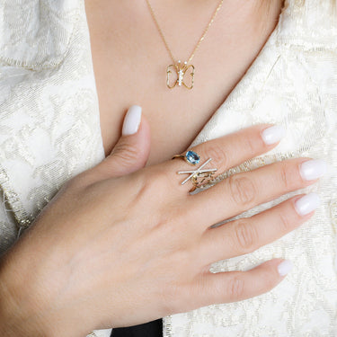 LUMINUS WINGS NECKLACE with butterfly design, 18k gold, and 0.06ct white diamond.
