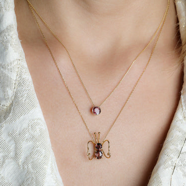 Luminus Wings Necklace with Brown Tourmaline in 18k Gold, elegant butterfly design.