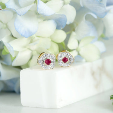 Delicate desert rose earrings with rubies and diamonds set in 18K gold.