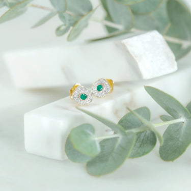 Delicate desert rose earrings with emeralds and diamonds in 18K gold.