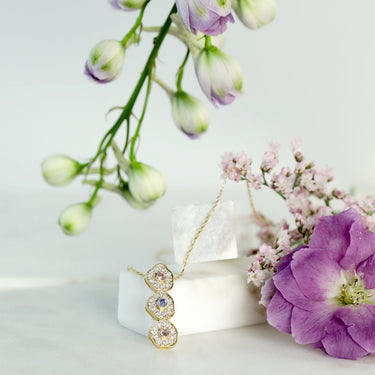 DESERT ROSE NECKLACE with sapphire and diamond flowers on 18K gold chain.