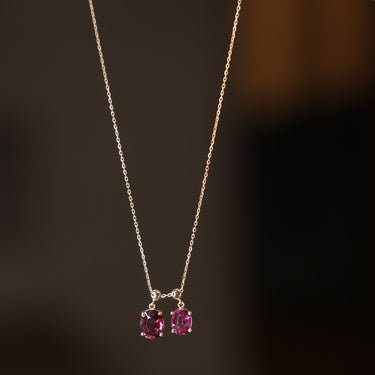 GEOMUSE NECKLACE - 18k gold with garnet stones, elegant jewelry piece.