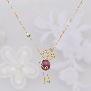 Handmade 18k gold necklace with ruby and diamond, symbolizing love and passion.