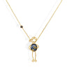 Handmade 18k gold necklace with blue sapphire and black diamond, symbolizing love and strength.