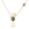Handmade 18k gold necklace with blue sapphire accent, symbolizing love and strength.