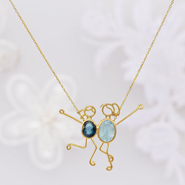 Handmade 18k gold necklace by DEMI & RUMER with blue topaz and spinel stones.