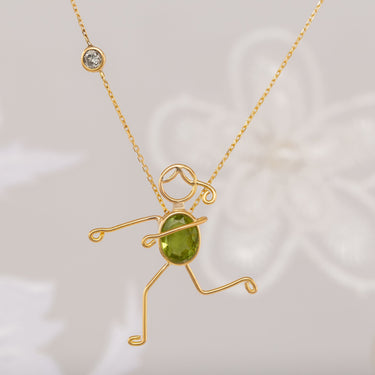 Handmade 18k gold necklace with peridot and diamond, symbolizing renewal and growth, GIANNA collection.