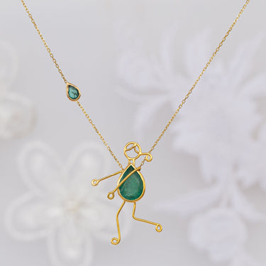 Handmade 18k gold necklace with pear-shaped emerald, symbolizing mother-child bond.