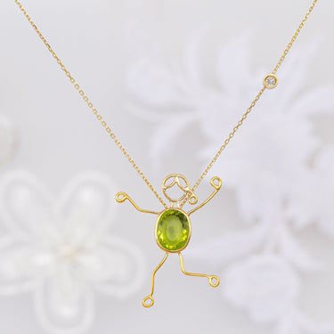 Handmade 18k gold necklace with peridot and diamond.