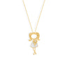 Gold character jewelry featuring a girl in a white dress holding a diamond flower.