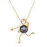 Handmade 18k gold necklace featuring a unique character design and a Tahitian pearl.