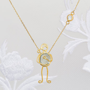 Handmade 18k gold necklace with aquamarine pendant symbolizing love and connection.