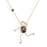 Handmade 18k gold character necklace with black and white diamond accents.