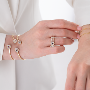 DESERT ROSE BANGLE with sapphires and diamonds in elegant design.