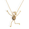 handmade 18k gold necklace with character pendant and sapphire accents