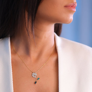 MARGUERITE NECKLACE with green enamel, diamonds, and 18K gold.